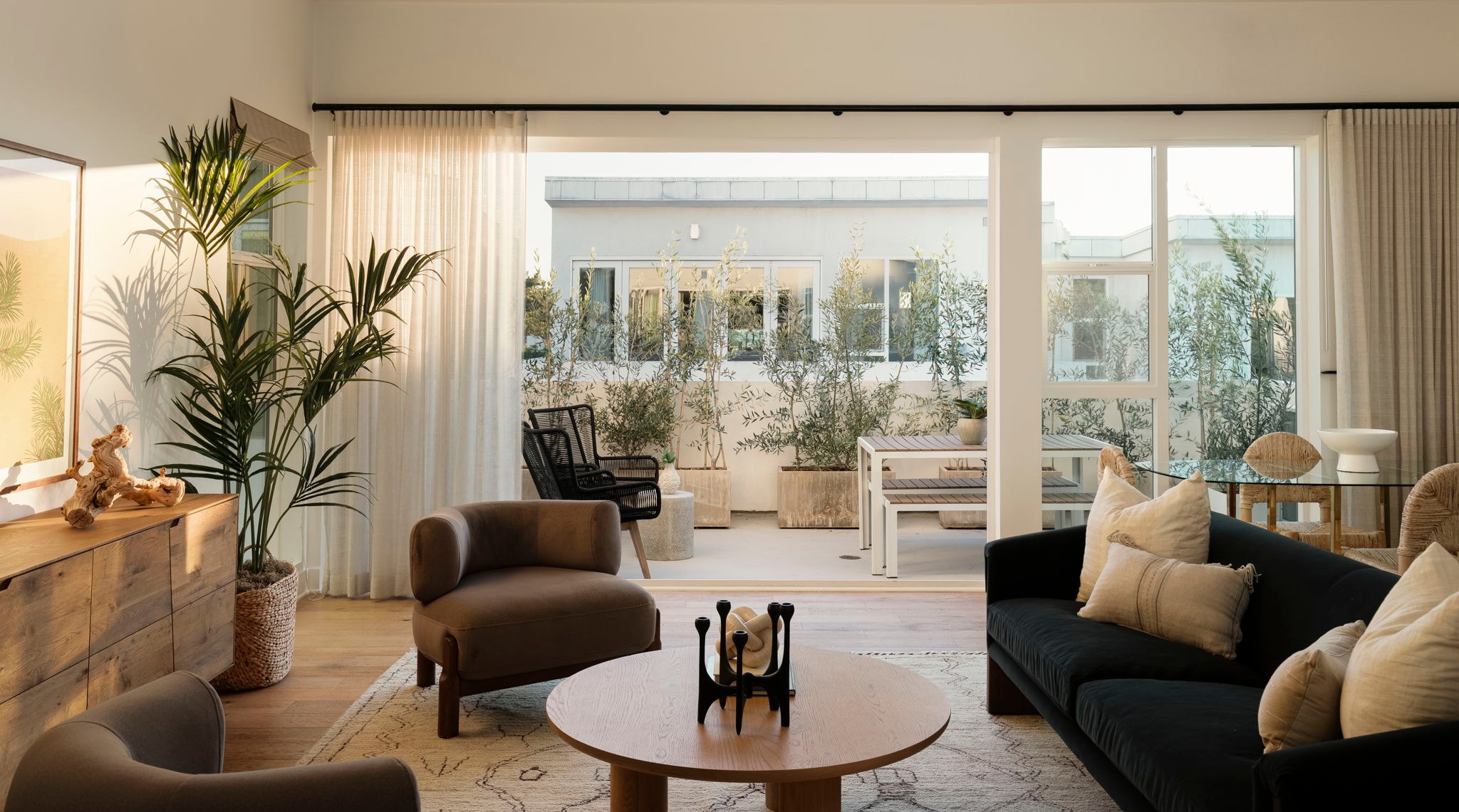 Warm living room with open terrace and natural materials